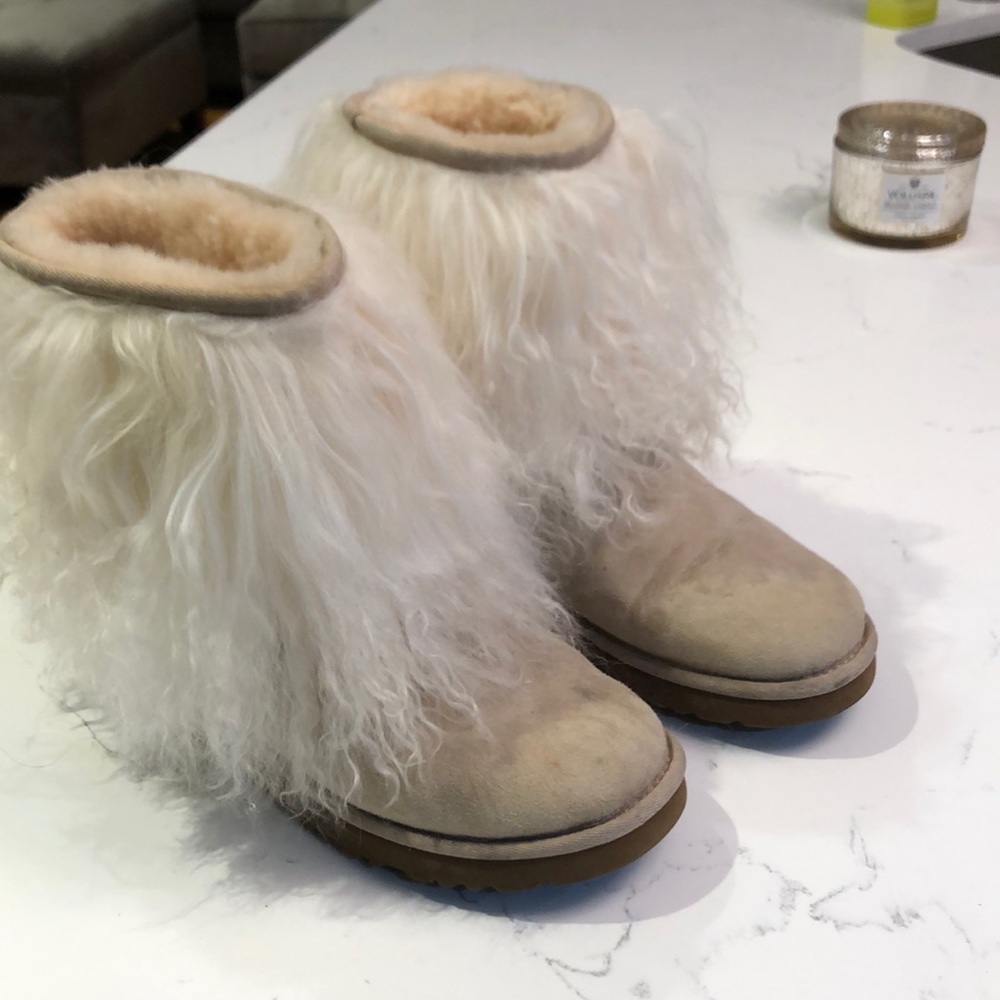 Monglian lamb Uggs in sand